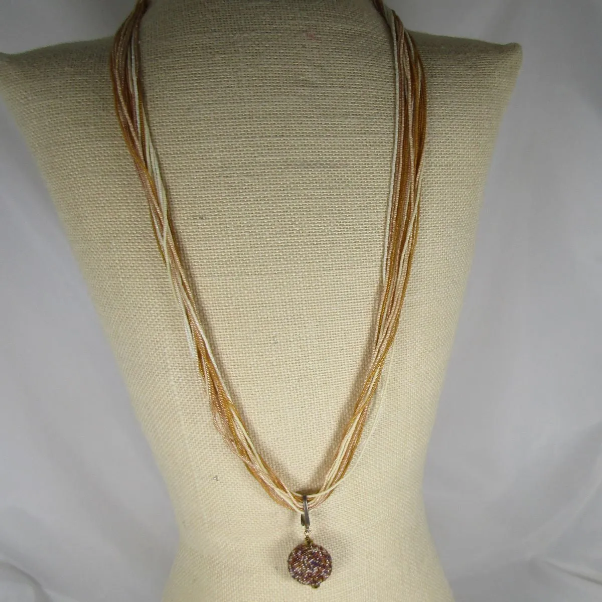 Flax Seed Bead Twisted Necklace with Gold Tone Pendant