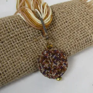 Flax Seed Bead Twisted Necklace with Gold Tone Pendant